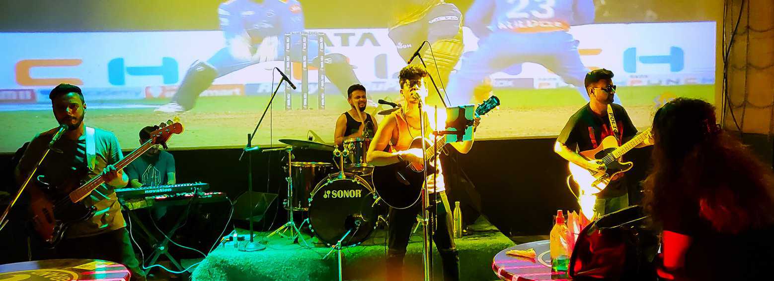 Night view of newer city/Live band playing at a Kolkata night club